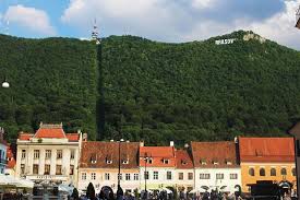 Don't say we didn't warn you. The Square In Brasov Romania Is Picturesque What Sign Do You Think Came First Brasov Or Hollywood Business Marketing Funny Tra Work Memes Brasov Life