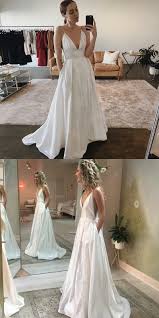 Can't envision yourself wearing long sleeves on your wedding day but strapless feels too bare? Simple A Line Deep V Neck Spaghetti Straps Open Back White Satin Wedding Dresses Wedding Dress With Pockets Spaghetti Strap Wedding Dress Vintage Ball Gowns