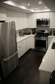 White and grey kitchens with dark floors and dark bedroom walls. Grey Walls White Cabinets Dark Floors Novocom Top