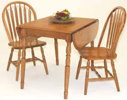 The dining table has four straight legs and a rectangular tabletop. Hausratversicherungkosten Cochrane Dining Room Furniture In Collection 6592
