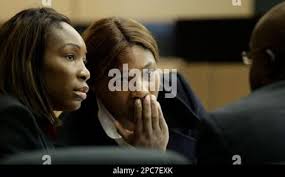 Tennis stars Venus, left, and Serena Williams talk with their attorney, F. Malcolm  Cunningham Jr., at their breach-of-contract lawsuit trial, Monday, Dec. 11,  2006, in West Palm Beach, Fla. Promoters Carol Clarke and Keith Rhodes,  owners of a company ...