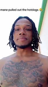 Dad Oulling Hot Dog Out of Mouth