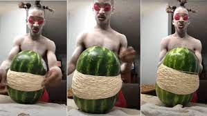The moment he put the last rubber band, the watermelon burst open spilling all over the room and hitting the man's face. Dakidd Hilarious Know Your Meme