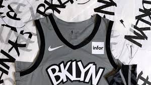 The akzidenz grotesk be condensed font is used for jersey lettering, player names, numbers, team logo, branding, and merchandise. Brooklyn Nets Unveil New Statement Uniforms Fans React Implurnt