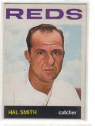Reverse reads: "Harry Craft. Red center fielder at Cincinnati, Ohio." This  is a photo of Harry Craft, a Cincinnati Reds center fielder, running for a  fly ball at Crosley Field in Cincinnati,