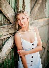 Beautiful Senior Girl Leaning Against Blue Barn Doors In A Simple White Dress In Spokane W Senior Pictures Girl Poses Senior Photos Girls Girl Senior Pictures