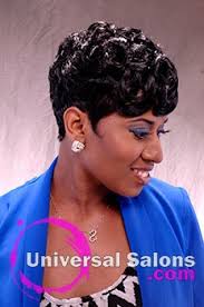 Pin the hair, which is dyed a lighter color to create beautiful curls on top and use a curling iron to style the waves on the bottom. Tasha Johnson S Onyx Swirl Short Curly Hairstyle