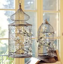You could place a ring of roses. Decorating With Vintage Bird Cages