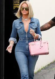 Martens booties, high socks and a gold chain necklace. Khloe Kardashian White High Top Sneakers Street Style Autumn Winter 2020 On Sassy Daily Khloe Kardashian Style Khloe Kardashian Outfits Khloe Kardashian Photos