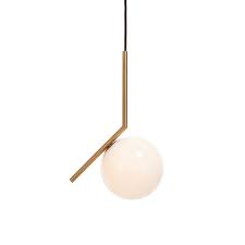 Satisfying Form And Function A Brass Rod Suspends From The Ceiling Emitting Soft Light From An Attached Blow Brass Pendant Light Pendant Light Light