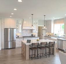 Simple And Open Kitchen Plenty Of Space Between The Island And The Perimeter Cabinets A Window Over The Sink For Views And Natural Ligh Kitchen Design Interior Design Kitchen Home Kitchens
