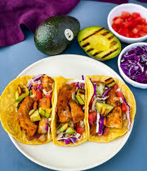 Blackened tilapia fish tacos topped with complementary refreshing sweet and tangy pineapple cucumber slaw and addictive silky avocado crema are the best light, flavorful and filling fish tacos that rival any restaurant! Blackened Fish Tacos