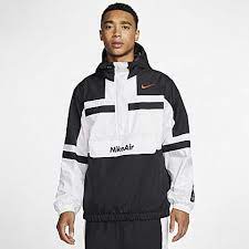 Black / yellow cotton air jordan print hoodie from nike featuring signature jumpman motif, logo print at the sleeve, drawstring hood, long sleeves, front pouch pocket and straight hem. Nike Sportswear Windrunner Hooded Windbreaker Nike Com Nike Air Jacket Woven Jacket Nike Jacket