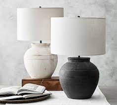 White interior, bed, pillow, night lamp. 30 Ceramic Table Lamps To Elevate Your Space Architectural Digest