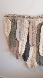 You can create one by knotting ropes around a wooden rod, or circular rings, etc. Feather Wall Macrame Hanging Macrame Wall Hanging Diy Wall Hanging Diy Wall Macrame