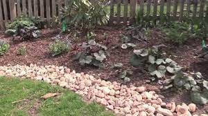 How to do rock garden edging. Edging Gardens With River Stones Youtube