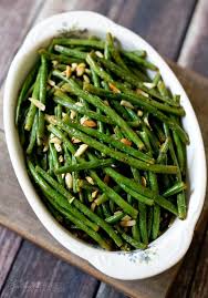 Green Beans Tossed With Lemon Olive Oil And Spices Roasted With Slivered Almonds Until The Beans Are T Green Beans With Almonds Green Bean Recipes Green Beans
