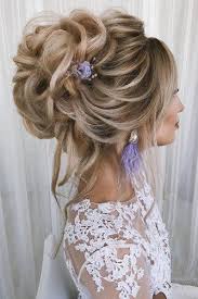 Then, look to your wedding dress neckline and veil to really narrow down your hairstyle—some necklines lend themselves better to updos than others. Elegant Wedding Updos For Long Hair Novocom Top