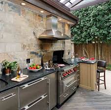 Incredible Guy Fieri Home Outdoor Kitchen Layout With Travertine Subway Wall Tile And Stain Outdoor Kitchen Covered Outdoor Kitchens Outdoor Kitchen Appliances