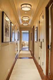 A Great Way To Address Lighting In A Hallway With A Low Ceiling Is To Create Repetition Using A Fl Hallway Light Fixtures Low Ceiling Lighting Hallway Lighting