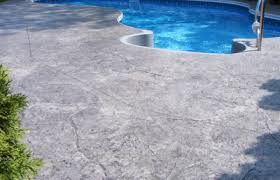 The person mentioned that the rock look stamped concrete was what many resort pools use. Stamped Concrete Patio Cost Concrete Company Pool Decks Brentwood
