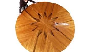 A circular dining table that expands when rotated. A Clever Circular Table That Expands To Twice Its Size With A Simple Turn Of The Tabletop