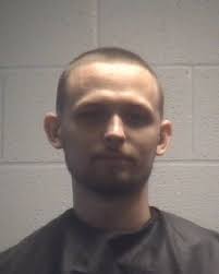 Two charged for having heroin, guns