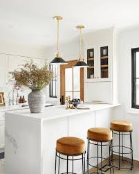 Emily wanted to give the curbly house a light, airy feel, so she dressed the windows with the stunning blinds.com roman shades in a crisp white. Sahjrjn1i3lham