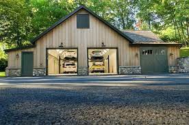 Nice Garage With Plenty Of Room And Car Lifts Very Cool Style With Rock Work Along The Bottom Of The Garage Garage Decor Garage House Garage Design