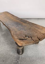 This coffee table pairs a little farmhouse style with handy storage to create a versatile anchor for your living room seating arrangement. Vintage African Coffee Table House Of Lolo
