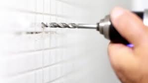 3) turn the disc at slow speed and use a sanding stick or small file to reduce the diameter. How To Drill Through Tile With Ease This Old House