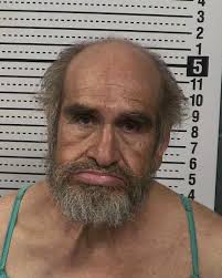 Humble employees in front of the Recreation Hall, Monroe City, Texas.  PARTIALLY identified: LEFT TO RIGHT: Jack Vernon Silva (1902-1974), leaning  against the left railing. Kneeling in front of the steps: Charles "