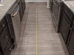 We loved the shade of the gray in this grey shaker kitchen cabinet! Colors To Compliment Gray Floors Dark Brown Cabinets