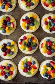 Individual Mini Fruit Pizzas Chewy Sugar Cookies Are Topped With Cream Cheese Frosting And Loaded Fruit Pizza Sugar Cookie Fruit Pizza Bar Fruit Pizza Recipe