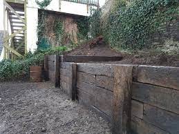 Reclaimed Railway Sleeper Retaining Wall Nick Dyson Landscaping Landscaping Retaining Walls Backyard Retaining Walls Railway Sleepers