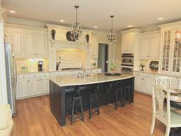 Image Result For Cream Kitchens With Black Island Images French Country Kitchen Cabinets Country Kitchen Cabinets Kitchen Cabinets And Backsplash