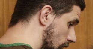 Arraignment postponed for accused shooter in bondsmen deaths