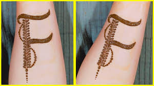 This n letter tattoo is inked in sleek and thin lines, and the alphabet is covered with beautiful vines giving the design a natural look. Alphabet N Tattoo Mehndi Design Hidden Letter Tattoo Mehndi Design N Tattoo Mehndi Design By Shireen Mehndi Designs