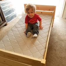 Using pocket holes, i attached the two ends of the bed to the sidepieces to make the frame. Make A Toddler Bed For Under 40 In One Day Loveourcrazylife