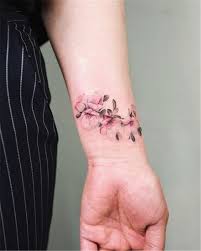 Meaningful Wrist Bracelet Floral Tattoo Designs You Would Love To Have Floral Tattoo Bracelet Flo Wrist Tattoos For Women Blossom Tattoo Flower Wrist Tattoos