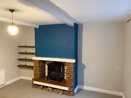 Keep swiping for before pics! Walls done in a dulux grey colour mix,  chimney breast in Dulux teal tension and woodwork including beams in  brilliant white satin wood.