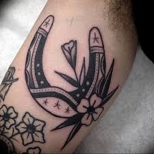 Horseshoe Tattoo Tattoo Ideas And Inspiration Tattoos Flower Tattoo Designs