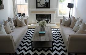 Do you know the difference between chevron and herringbone patterns, both common in tile and above: Black And White Chevron Rug Contemporary Living Room Belmont Design Group
