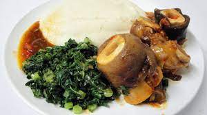 How To Make Zimbabwean Sadza And Serve It Zimbabwe Food African Food Pork Trotter Recipe
