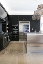 Get more kitchen renovations tips and ideas from. All Black Kitchen With White Oak Floors And Stainless Steel Island Very Modern Steel Kitchen Cabinets Stainless Steel Kitchen Cabinets Black Kitchen Cabinets