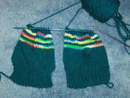 Since the mittens will be connected by braids,you need one more special spoke. Bev S 2 Needle Mittens