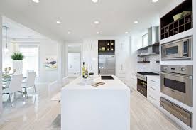 Make your kitchen look bigger with these ideas of kitchens with light wood floors. Wood Look Tile Flooring With White Kitchen Cabinet Designs