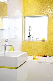Refurbishing your bathroom and kitchen with yellow ceramic tile colors can amp up the ambiance and make your kitchen less drab. Bright Sunny Yellow Bathroom Decor Yellow Bathrooms Yellow Bathroom Tiles
