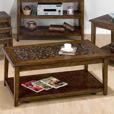 Coffee table tiles should always look refreshing, unique and elegant, as that is where you would sit for a fresh cup of coffee and feel rejuvenated. Belfort Essentials Baroque Brown Mosaic Tile Inlay Cocktail Table With Hidden Casters Belfort Furniture Cocktail Or Coffee Table