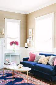Does your living room need a little sprucing up? How To Get The Designer Look In Your Home On A Budget Blue Couch Living Room Blue Living Room Living Room Colors